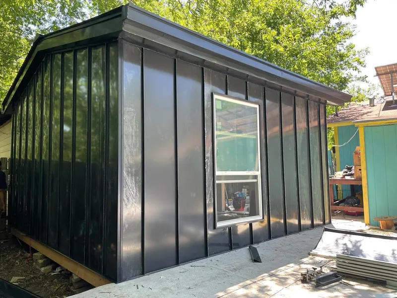 Black standing seam metal wall panels for Roof Inspection in Irving