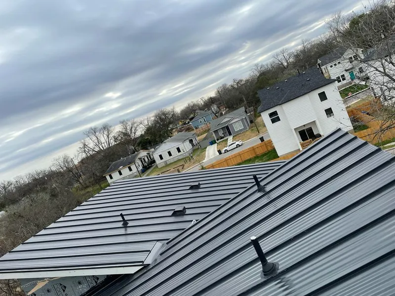 Standing seam metal roof panels with vents for Skylight Repair in Irving